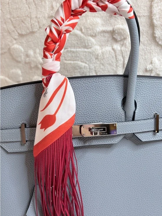 Trendy Fringe Handbag Wrap with Orange Fringe and Bold White Flower Pattern - Picture 8 of 10